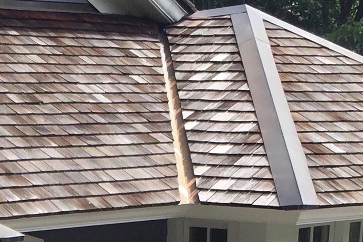 An open valley on a cedar shingle roof installed by Sheeley Roofing.