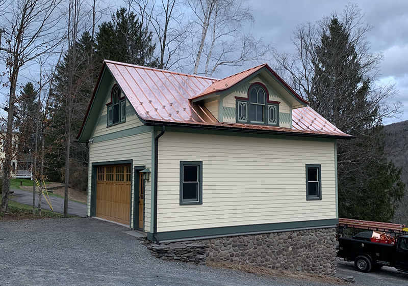 Elegant home featuring a newly installed copper roof, highlighting its timeless aesthetic.