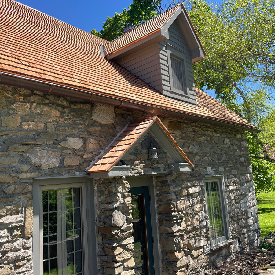 Stone house with cedar shingles