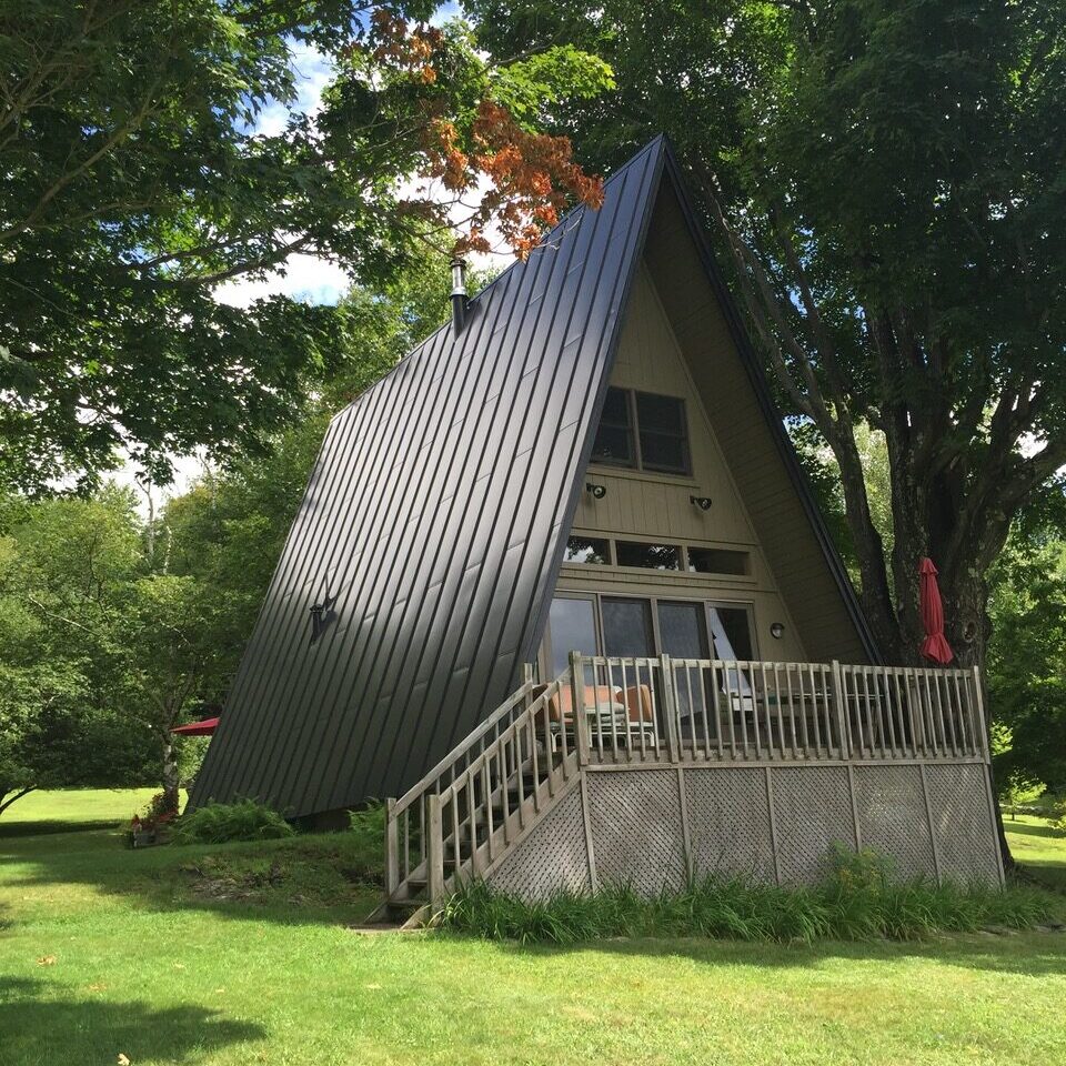 A-Frame house with a dark metal roof