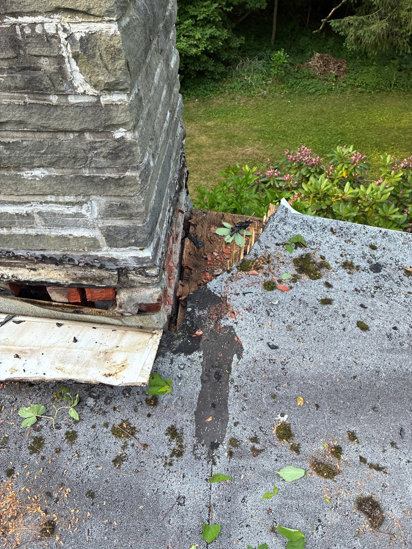 damanged stone chimney